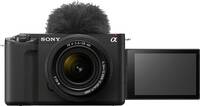 Sony Alpha ZV-E1 in schwarz mit FE 4-56-28-60mm und Schwenkdisplay und Mikrofon von vorne